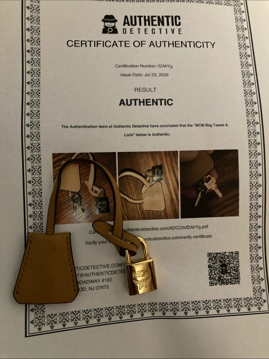 MCM Other - MCM Gold Padlock Key Charm with Tan Leather Clochette. With COA
